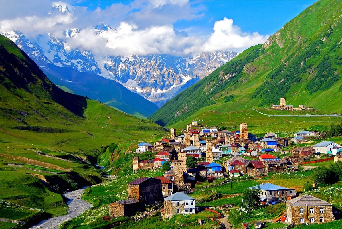 Ushguli highland village in Svaneti with the snow peaks of the Greater Caucasus behind